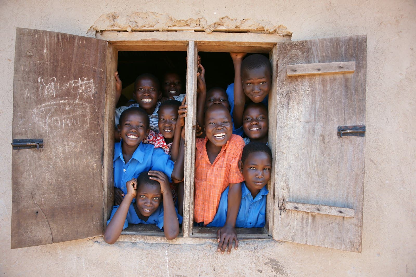 Students gathered at a classroom window